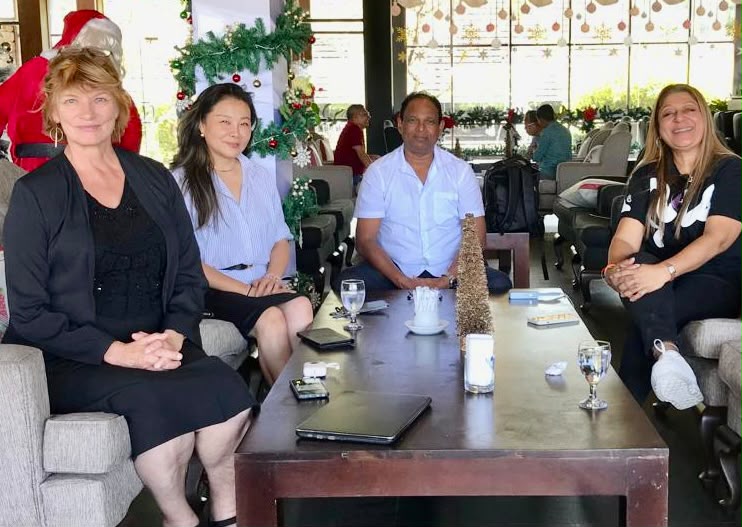 Geo Ventures team meeting with travel partners in a hotel lounge
