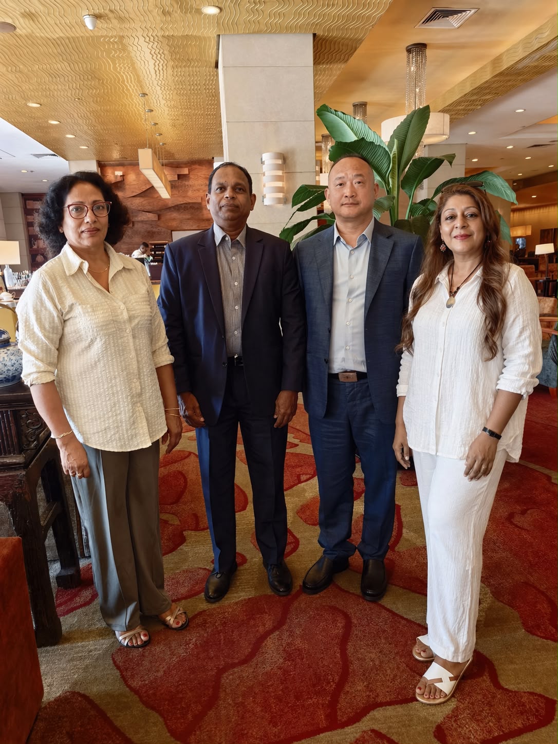 Geo Ventures team with business partners in a hotel lobby